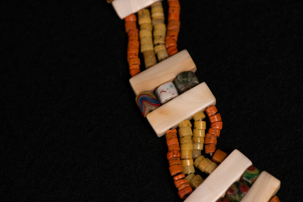 Paiwan tribe old Glass beads collar In Paiwan society, ancient and valuable glass beads are treasured as heirlooms or betrothal gifts, symbolizing aristocratic status. These beads are often carefully stored in old pottery jars.