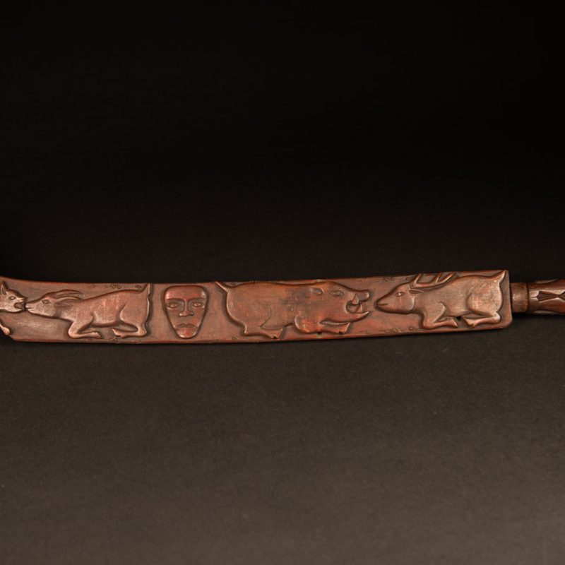 Very beautiful celebration sword from the Puyuma tribe, carved with motifs of a dog chasing a deer, a wild boar, and a human figure.