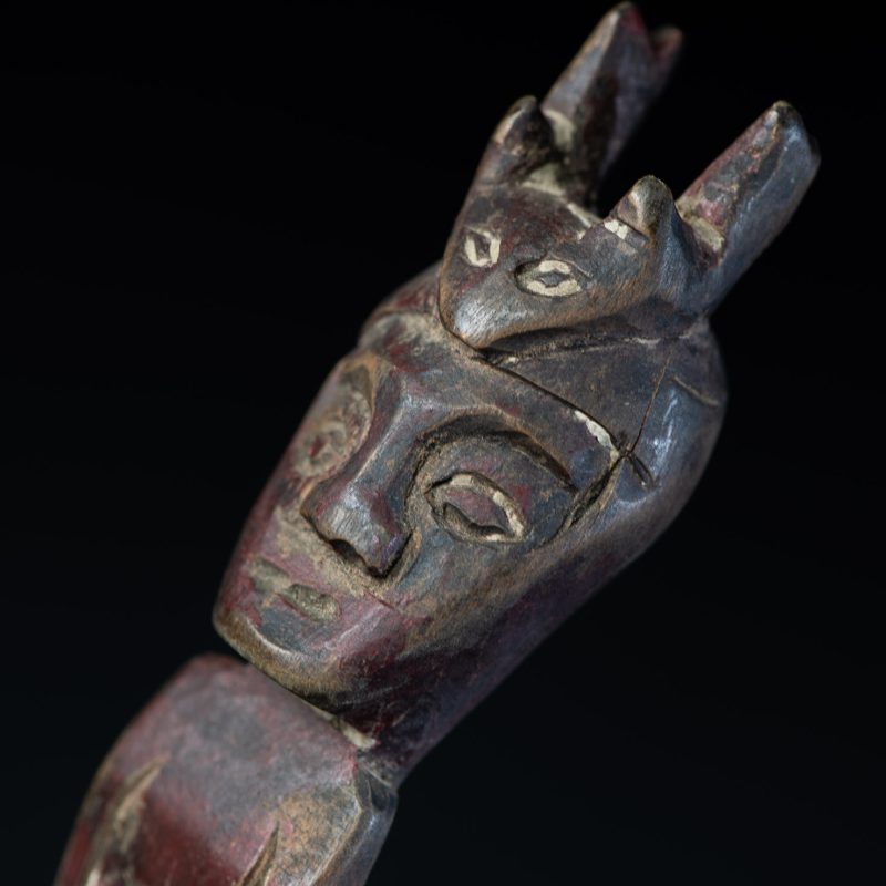 Old spoon from the Paiwan tribe, tinted with red pigments and depicting an ancestor wearing a ceremonial headdress.