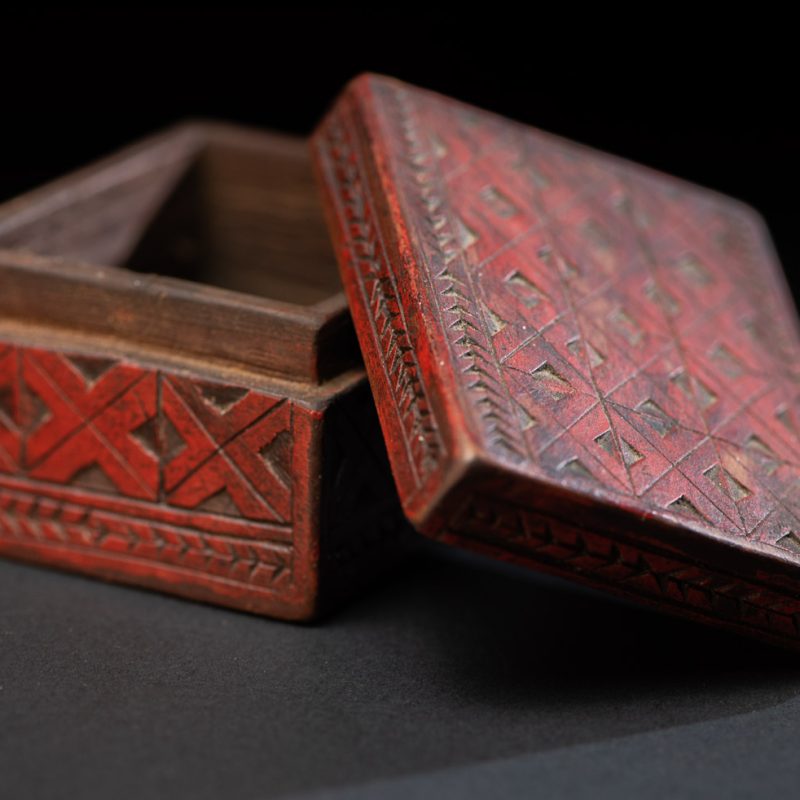 Paiwan tribe wooden Box paint with red pigments with geometrical patterns.
