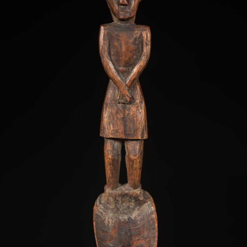 Large spoon from the Paiwan tribe, carved with a Paiwan man in traditional attire. Very finely carved.